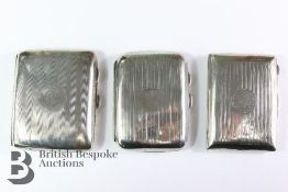 Five Silver Cigarette Cases and Two Lighters
