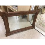 A FRENCH OAK FRAMED MIRROR 93 X 65 CM