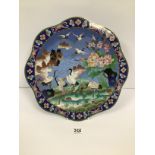 A LARGE ORIENTAL CLOISONNE ENAMEL WALL CHARGER WITH SCENE TO THE FRONT DEPICTING STALKS IN WATER,