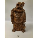 A WOODEN LAUGHING BUDDHA 43 CMS HIGH