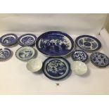 A COLLECTION OF ORIENTAL BLUE AND WHITE PORCELAIN ITEMS, INCLUDING A LARGE PLATE, SIDE PLATES AND