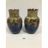 A PAIR OF LARGE ROYAL DOULTON GLAZED STONEWARE VASES WITH TUBE LINED DECORATION WITH BANDS OF FRUIT,