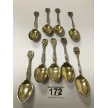 A SET OF NINE SILVER TEASPOONS WITH GILT BOWLS AND CAST TERMINALS, HALLMARKED BIRMINGHAM FROM THE