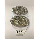 A PAIR OF HEAVY SILVER CAST OVAL BON BON DISHES WITH PIERCED BORDERS, IMPORT MARK FOR BIRMINGHAM