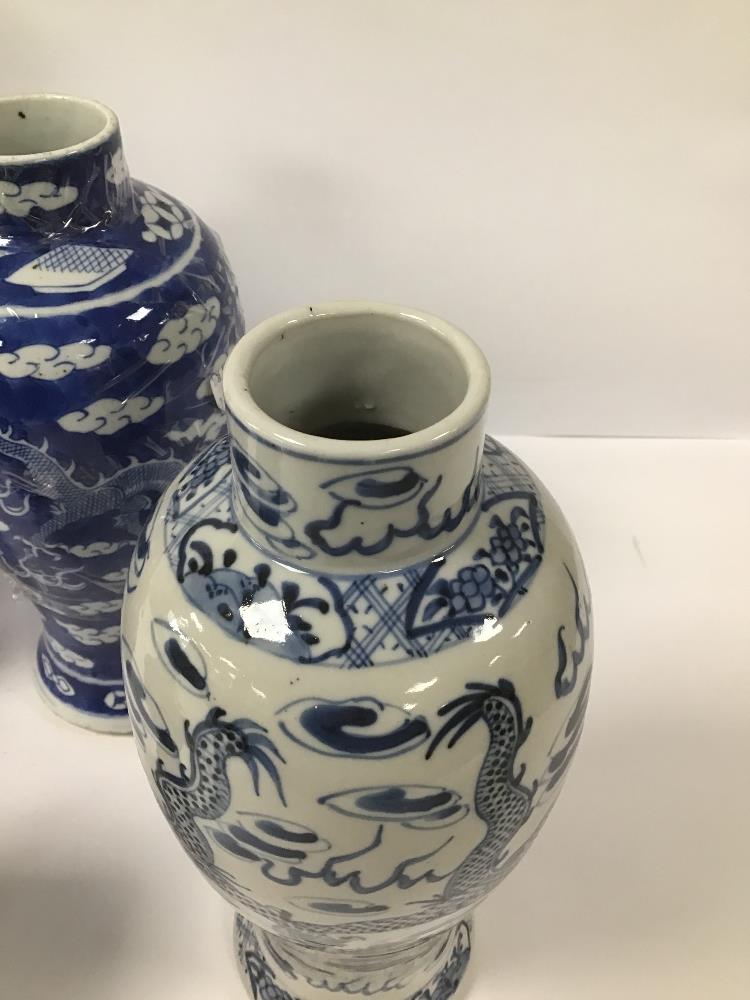 FOUR BLUE AND WHITE CHINESE PORCELAIN VASES, TWO OF WHICH DEPICTING A DRAGON CHASING THE FLAMING - Image 3 of 5