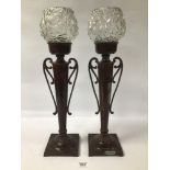 A PAIR OF BRONZE TABLE LAMPS SHAPED AS TWIN HANDLE VASES WIH GLASS SHADES 54 CMS