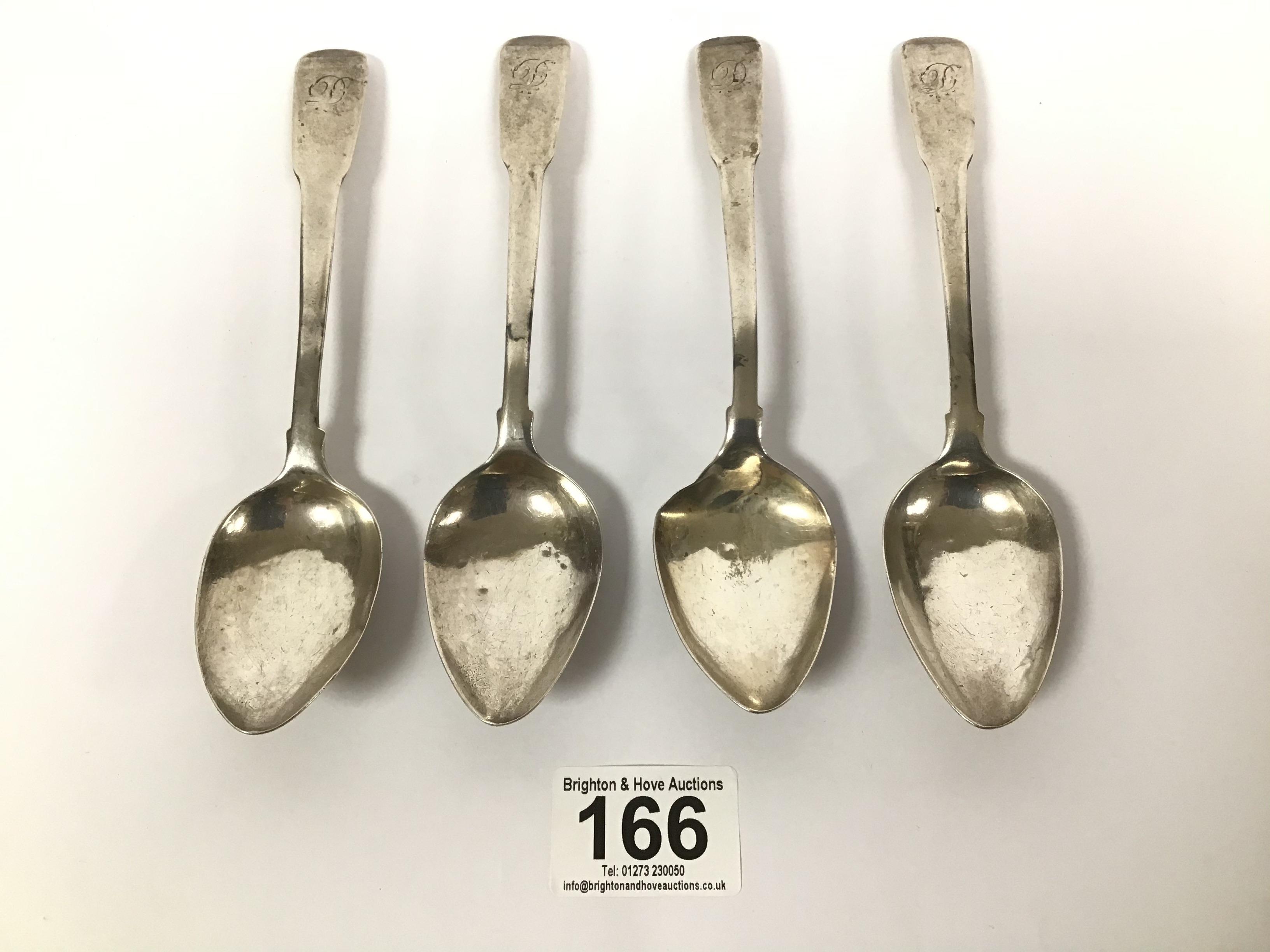 A SET OF FOUR GEORGE III SILVER DESSERT SPOONS, HALLMARKED NEWCASTLE BY JOHN ROBERTSON II AND JOHN