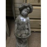 A CONCRETE STATUE OF A YOUNG GIRL CARRYING A BASKET OF PUPPIES 70 CMS