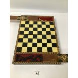 A VINTAGE GAMES BOX, OPENING TO REVEAL A CHESS BOARD WITH PIECES HIDDEN IN TWO SECRET