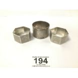 THREE HALLMARKED SILVER ENGINE TURNED NAPKIN RINGS ( ONE PAIR ) 67 GRAMS