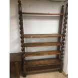 A BARLEY TWIST DISPLAY STAND WITH BOTTOM CUPBOARD 217 X 34 X130 CM