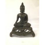 AN ORIENTAL BRONZE FIGURE OF BUDDHA IN A SEATED POSITION RAISED UPON A BASE 40 CMS