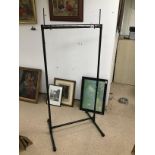 A BLACK METAL STAND IDEAL FOR ADVERTISING