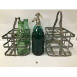 TWO GREEN GLASS SODA SIPHONS WITH TWO GALVANISED VINTAGE MILK CRATES AND TWO GREEN GLASS BOTTLES