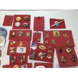 COLLECTION OF VINTAGE BADGES WITH A STAMP