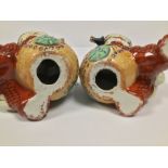 A PAIR OF CHINESE RED CERAMIC DOGS OF FAUX, 19CM HIGH