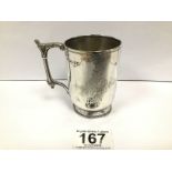 A VICTORIAN SILVER CHRISTENING MUG WITH EMBOSSED AND ENGRAVED DECORATION THROUGHOUT, HALLMARKED