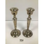 A PAIR OF SILVER CANDLESTICKS WITH WEIGHTED BASES, HALLMARKED BIRMINGHAM 1965 BY COHEN & CHARLES,