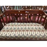 AN EDWARDIAN TWO SEATER MAHOGANY SEAT WITH WILLIAM MORRIS FABRIC CUSHION