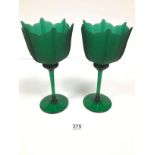 A PAIR OF GREEN OVERSIZED WINE GLASSES WITH FLOWER LIKE BOWLS, 29CM HIGH