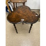 A VINTAGE CLOVER LEAF STYLE THREE LEG TABLE WITH FLOWER DESIGN TO THE TOP