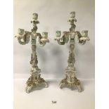 A PAIR OF LATE 19TH CENTURY GERMAN PORCELAIN FLORAL ENCRUSTED 4 BRANCH CANDELABRA 52 CMS A/F