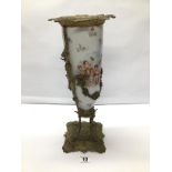 A LIMOGES PORCELAIN VASE DECORATED WITH CHERUBS SURROUNDED BY BRASS GILDING AND TO THE BASE 41 CMS