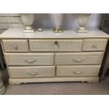 A CREAM WOODEN SEVEN DRAWER SIDEBOARD 148 X 46 X 82 CMS