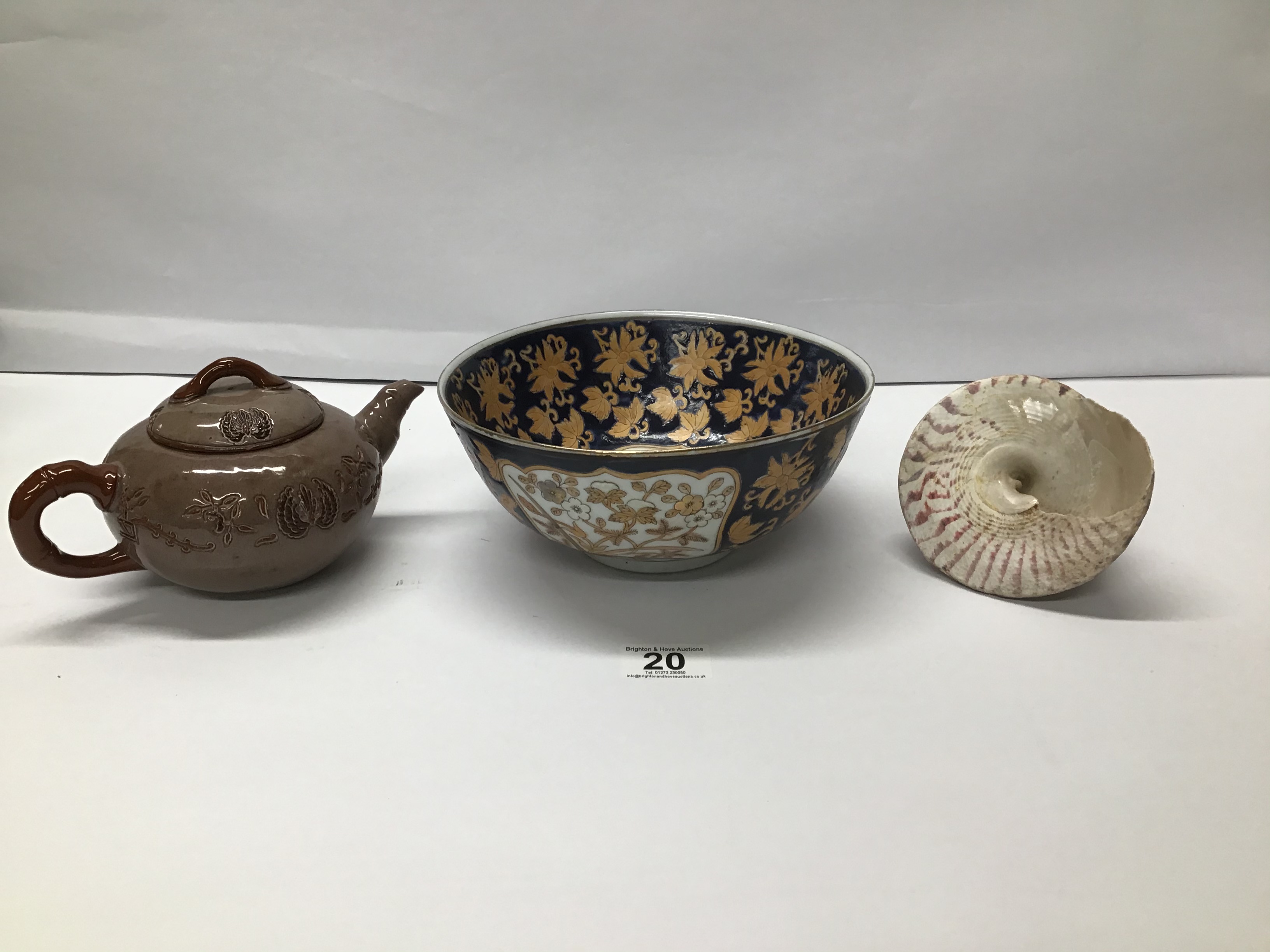 A CERAMIC TEAPOT AND A ORIENTAL BOWL WITH A SEA SHELL