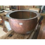 A LARGE COPPER CAULDRON 61 CM DIAMETER