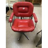 A VINTAGE CHROME AND RED LEATHER SWIVEL CHAIR