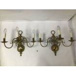 A PAIR OF VINTAGE THREE BRANCH ARM BRASS WALL LIGHTS