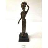 A BRONZE FIGURE OF AN AFRICAN WOMEN, INDISTINCTLY SIGNED TO BASE, RAISED UPON WOODEN BASE, 34CM