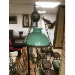 A LARGE GILT METAL HANGING LANTERN WITH GREEN GLASS SHADE, APPROX 75CM HIGH