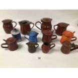 A COLLECTION OF FRENCH ENAMEL LIDDED POTS, INCLUDING MAROON AND ORANGE EXAMPLES