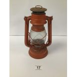 A VINTAGE JAPANESE RED PAINTED HURRICANE LAMP, HINGED WHEEL NO 400, 23.5CM HIGH