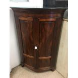 A GEORGIAN FLAME MAHOGANY CORNER UNIT