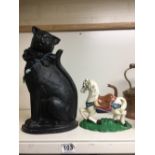 TWO CAST IRON DOORSTOPS, THE LARGEST IN THE FORM OF A CAT, 37CM HIGH