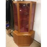 A TEAK MID CENTURY DISPLAY CORNER UNIT BY TURNIDGE OF LONDON