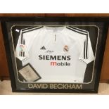 A SIGNED DAVID BECKHAM SHIRT FROM HIS TIME AT REAL MADRID, FRAMED AND GLAZED WITH CERTIFICATE OF