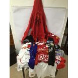 A BOX OF VINTAGE MANCHESTER UTD FOOTBALL SHIRTS AND T-SHIRTS