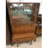 A MID-CENTURY COCKTAIL DISPLAY CABINET BY TURNIDGE OF LONDON