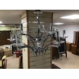 A MODERN CHROME AND CRYSTAL EIGHT BRANCH CHANDELIER