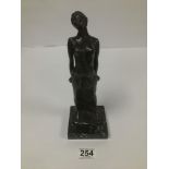 A BRONZE FIGURE OF A SCANTILLY CLAD FEMALE, RAISED UPON MARBLE BASE, TITLED TO THE BASE; ROSANNE M