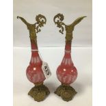 A PAIR OF UNUSUAL LATE 19TH/EARLY 20TH CENTURY PINK GLASS AND GILT METAL URNS, 22.5CM HIGH