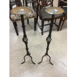 A PAIR OF WROUGHT IRON CANDLE PRICKS 88CMS