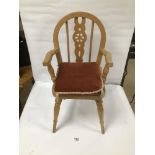 A SMALL CHILDS WOODEN ARMCHAIR, 63CM HIGH