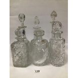 SIX CUT GLASS DECANTERS OF VARYING SHAPES AND SIZES, ONE BEARING ORIGINAL LABEL STATING MADE IN