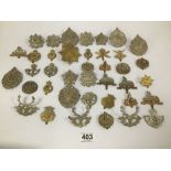AN ASSORTMENT OF MILITARY CAP BADGES, VARIOUS REGIMENTS AND SIZES