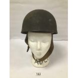 A WWII ERA MILITARY HELMET, MARKED TO INSIDE OF LEATHER LINER 'BMB3 1945' 27CM WIDE